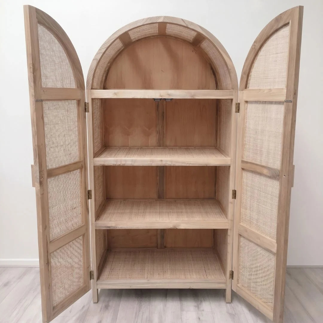 Wooden cabinet with wicker doors on a white background