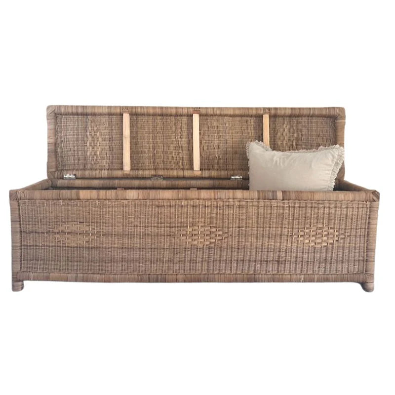 Wicker bed with a pillow on a white background