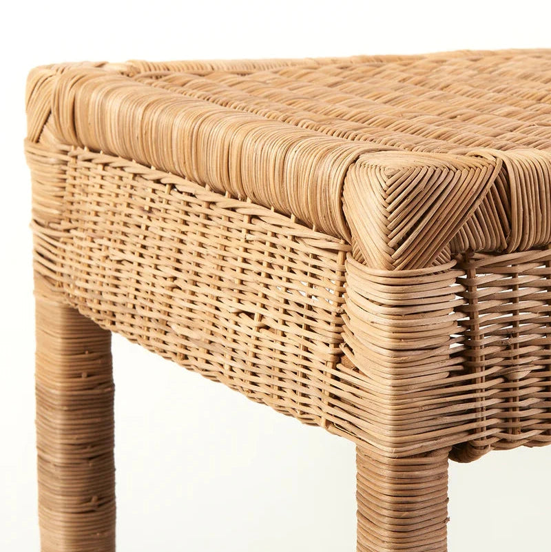 Wicker console
with a natural woven design on a white background
