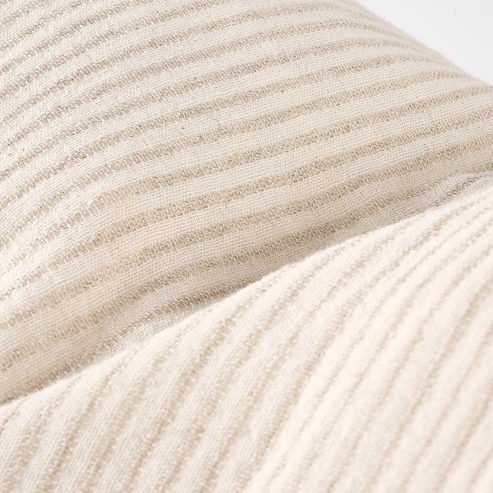 Close-up of beige textured fabric with subtle pattern