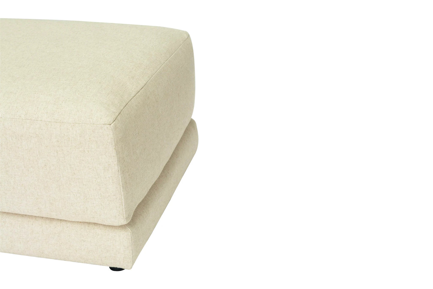 Light beige linen ottoman on a white background