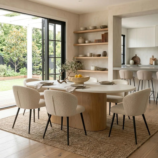 Jansen Oval and microcement dining table the Aster linen chairs.