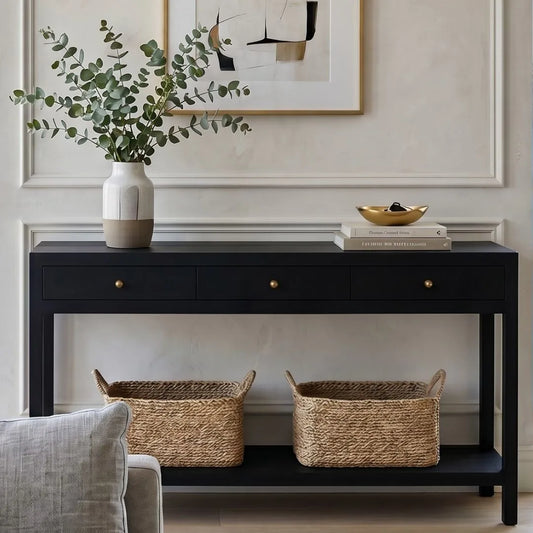 Black console table with decorative items in a living room setting