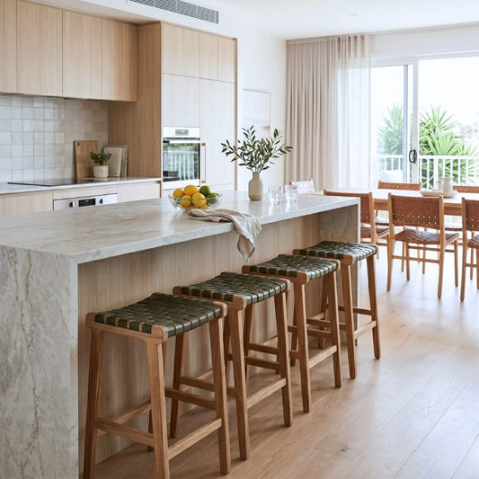 Modern kitchen with island bench and olive leather stools