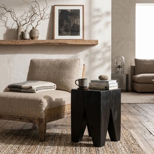Black Teak square peg stump stool in a rustic wabi sabi style living room