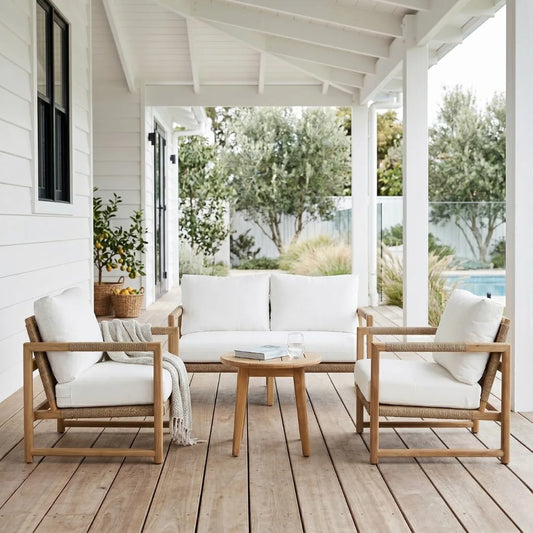 Outdoor patio set with wooden chairs and table on a wooden deck.