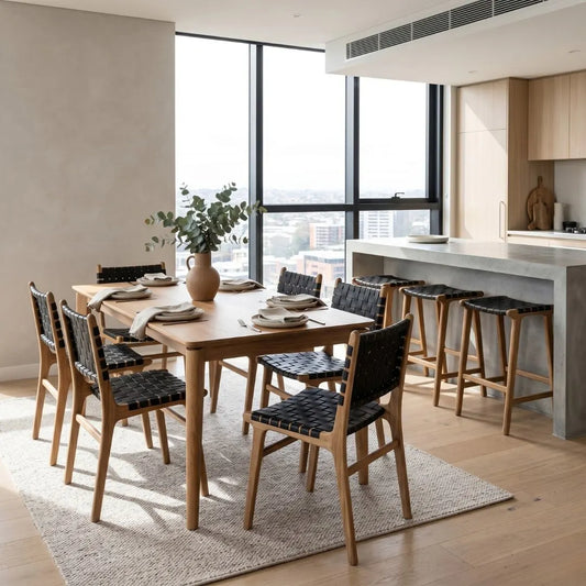 Modern dining area with wooden table and chairs in a well-lit room.