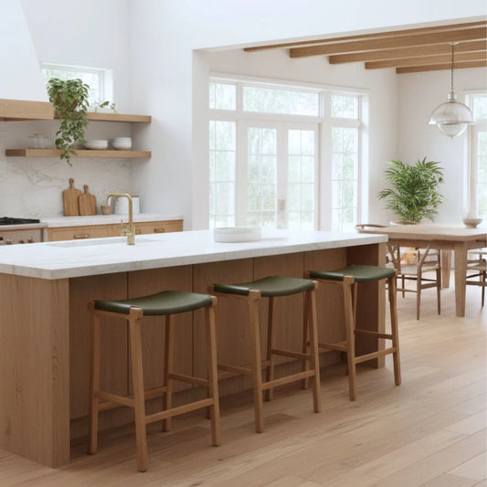 Sun Republic Olive leather and teak counter stools at a kitchen island bench in a modern kitchen