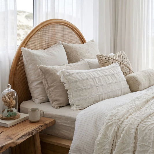 Lulu long lumbar cushion styled in a modern coastal boho bedroom by sun republic