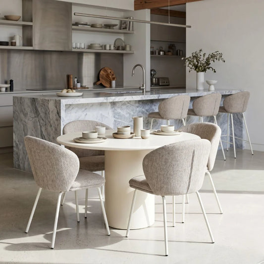 Modern kitchen with marble island and dining area