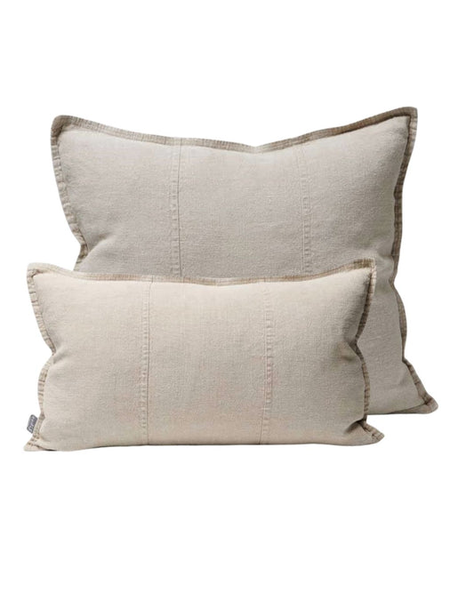 Two beige pillows with textured fabric on a white background