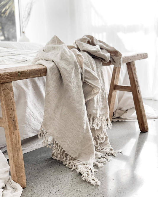 Omala natural pure linen throw styled in elegant bedroom with neutral decor