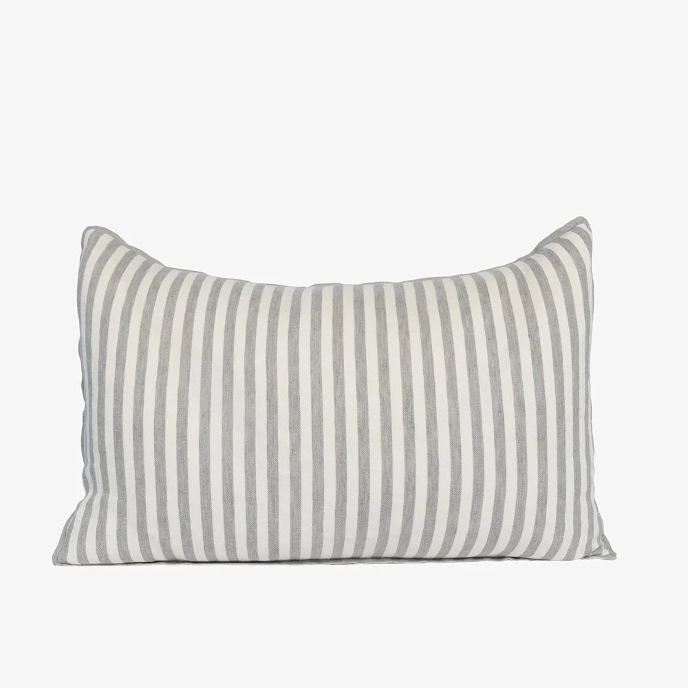 A rectangular throw pillow with vertical green and off-white stripes, shown against a plain light gray background.