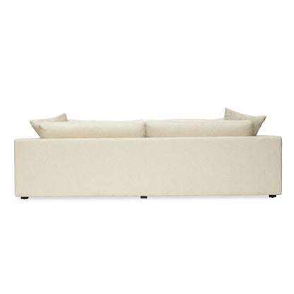 Beige sofa with two cushions on a white background