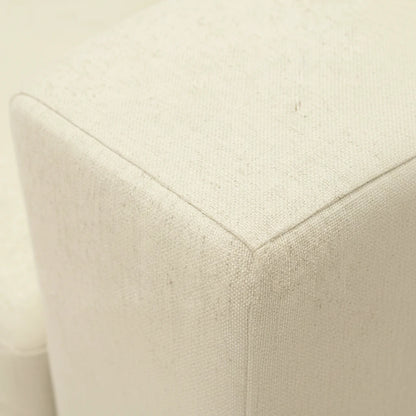 Close-up of a textured beige fabric surface