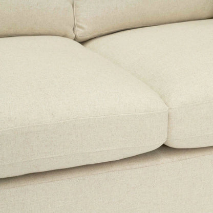 Close-up of a beige sofa with a soft texture