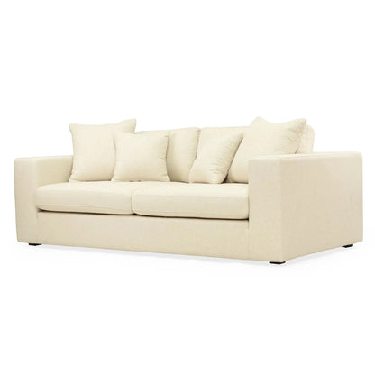 Beige sofa with cushions on a white background