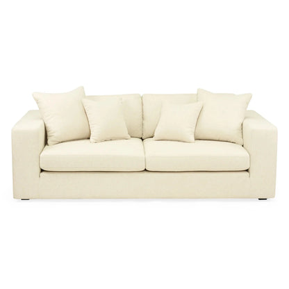 Beige sofa with cushions on a white background
