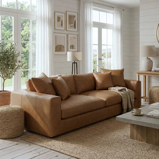 Brown sectional sofa in a bright living room with large windows and decorative elements.