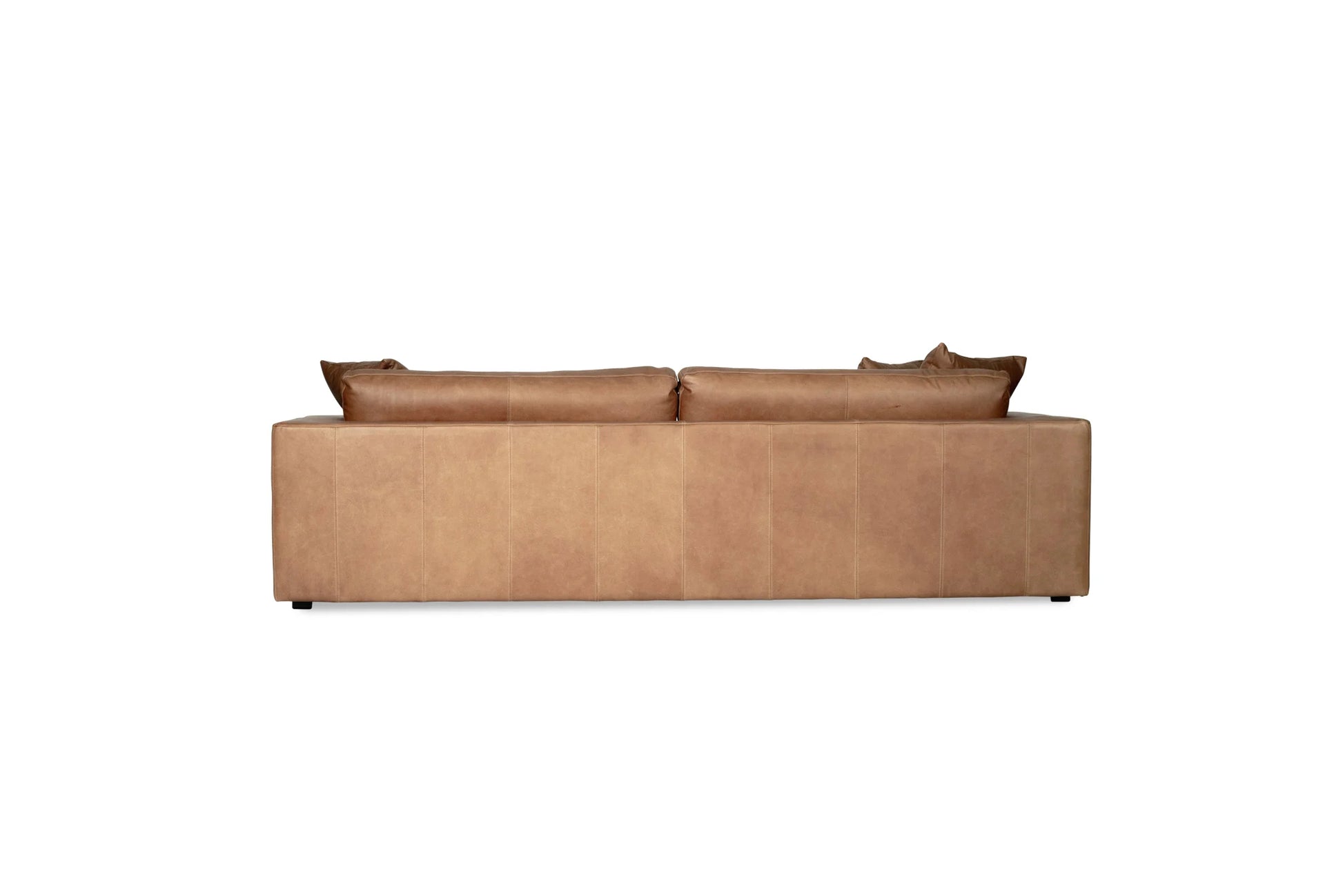 Tan brown saddle leather sofa with cushions on a white background from Sun Republic