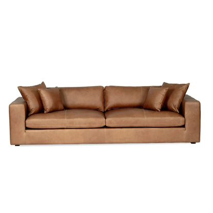 Tan brown saddle leather sofa with cushions on a white background from Sun Republic
