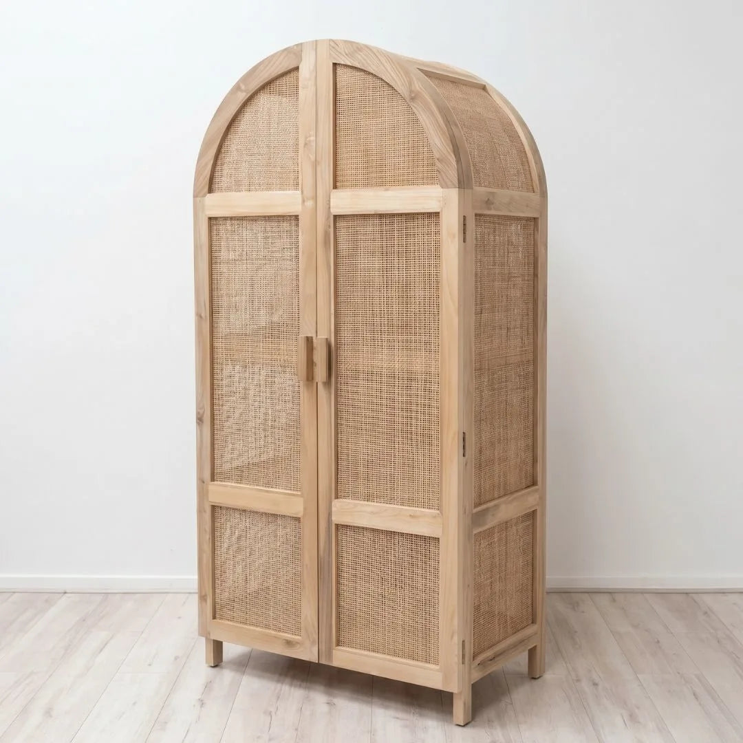 Wooden armoire with wicker doors on a white background