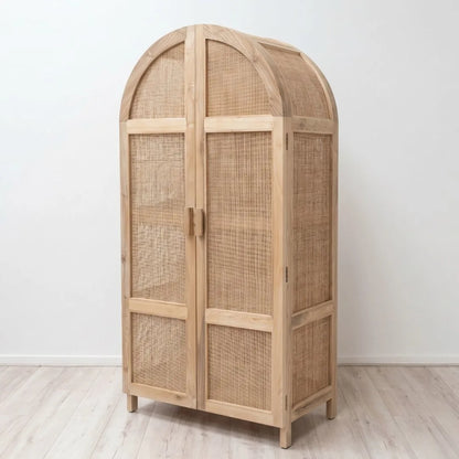 Wooden armoire with wicker doors on a white background