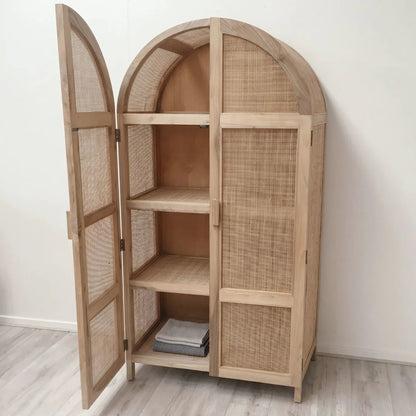 Wooden armoire with wicker doors on a white background