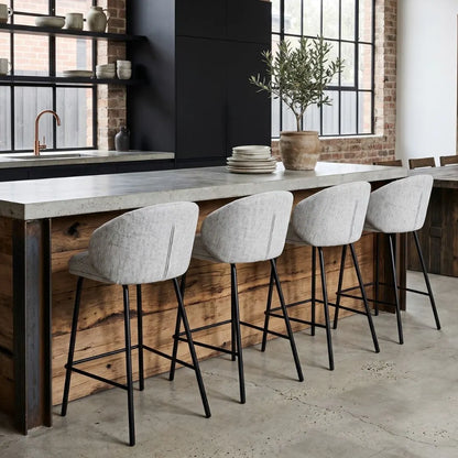 Modern kitchen with wooden bar counter and stools, featuring a plant and shelves.