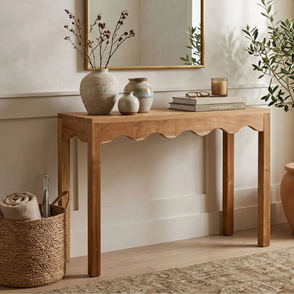 Wooden console table with decorative items in a room setting