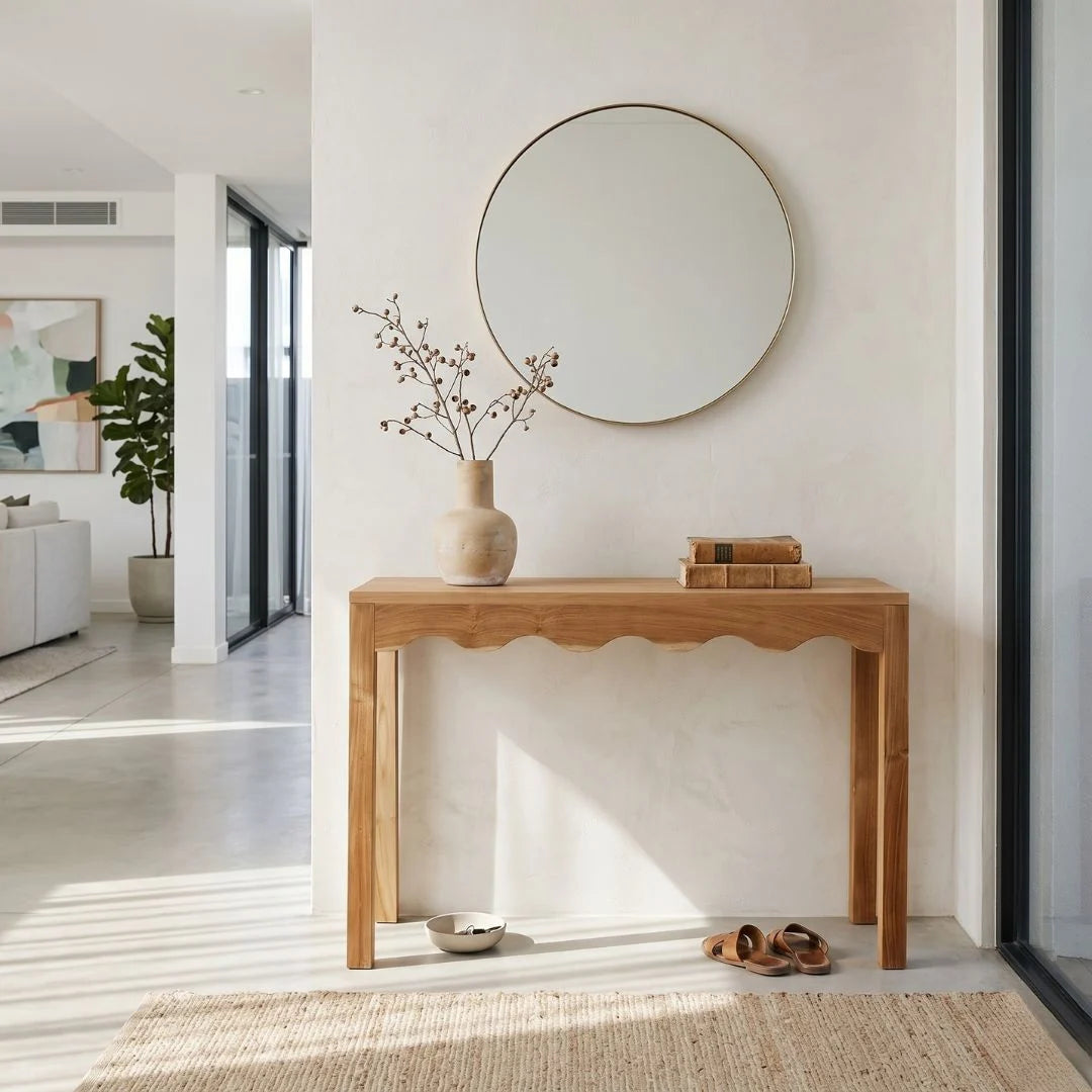 Wooden console table with decorative items in a modern living room.