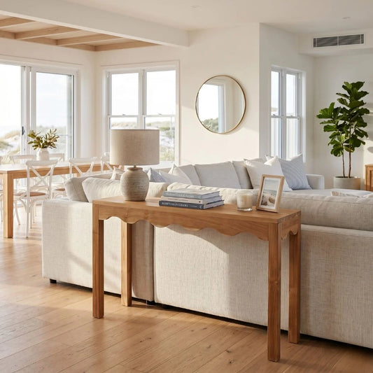 Living room with a wooden console table, sofa, and decor items.