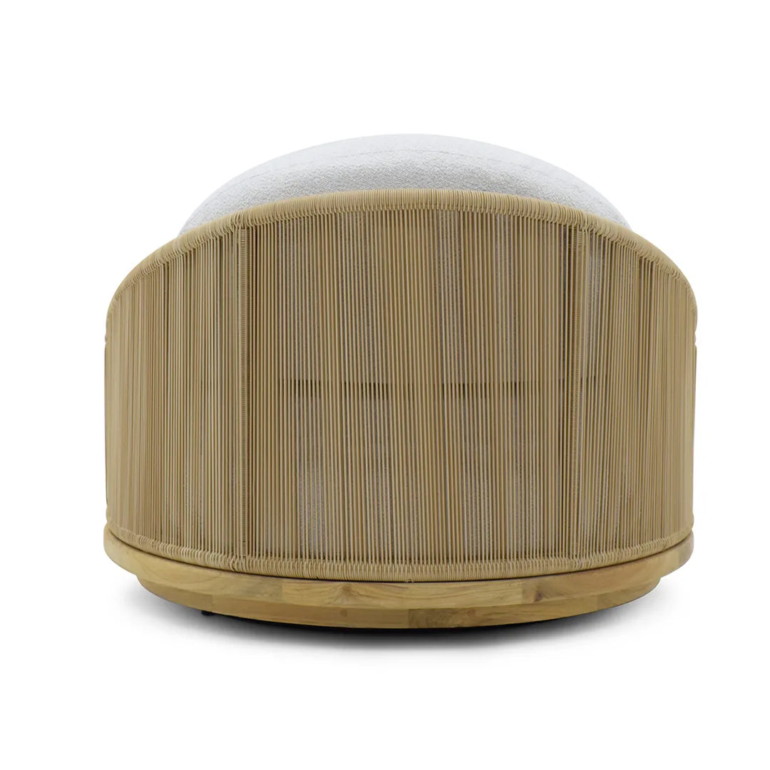 Round ottoman with bamboo-like texture and white cushion on a white background