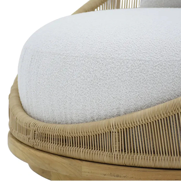 Close-up of a cushioned chair with woven frame on a white background