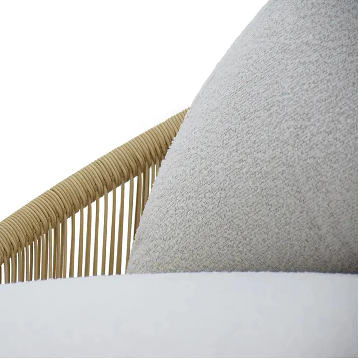Close-up of a chair with a woven backrest and cushion on a white background