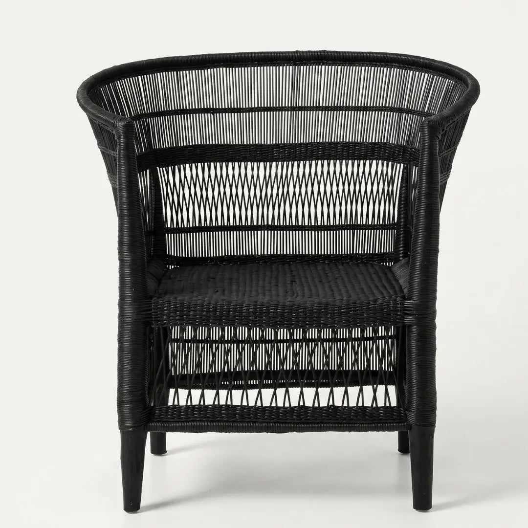 Black wicker armchair on a white background