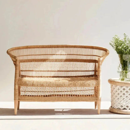 Wicker chair with a plant on a white background
