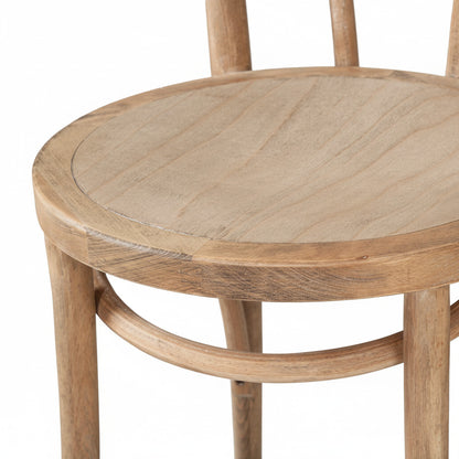 Wooden round table with four matching chairs on a white background