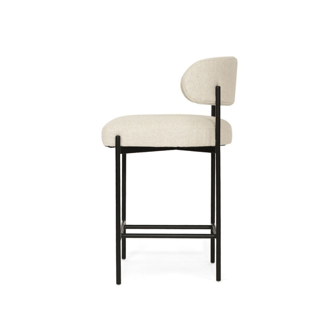 Bar stool with beige cushioned seat and backrest on a white background