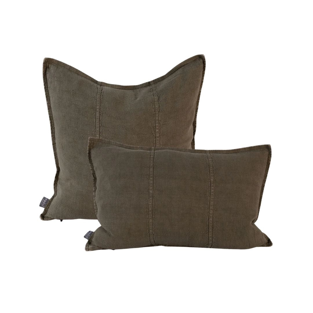Two brown pillows on a white background
