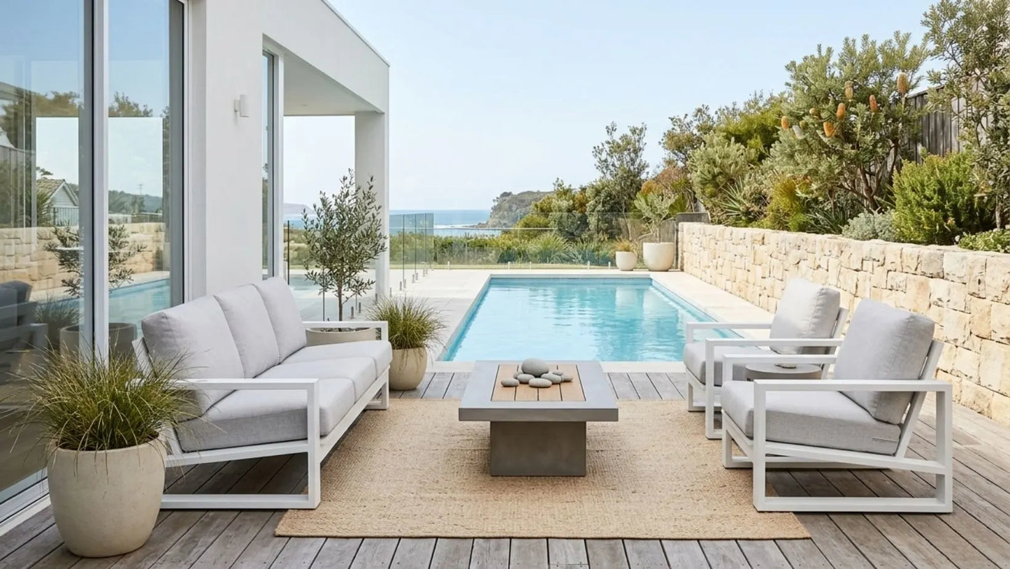 Outdoor patio with modern furniture and a pool