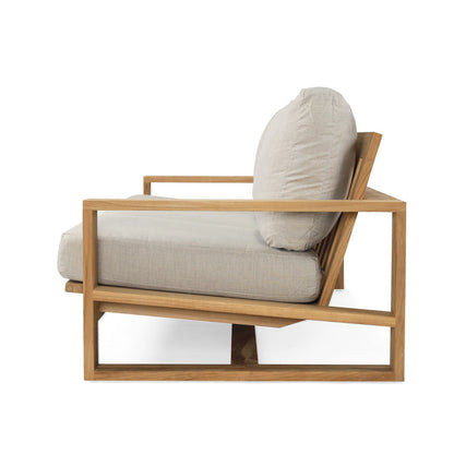 Modern chair with wooden frame and beige cushions on a white background