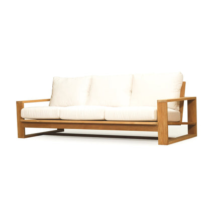 Teak outdoor sofa with white cushions on a white background