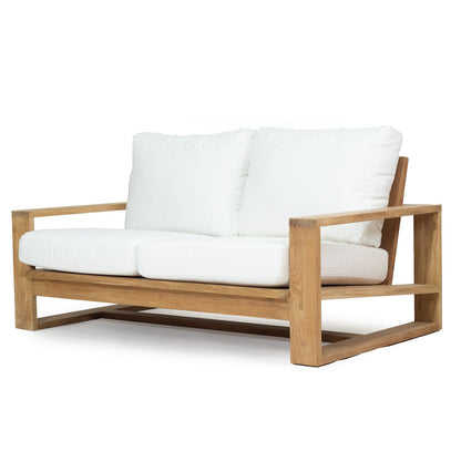 Solid Teak Outddoor sofa with white Sunbrella weather proof cushions on a white background