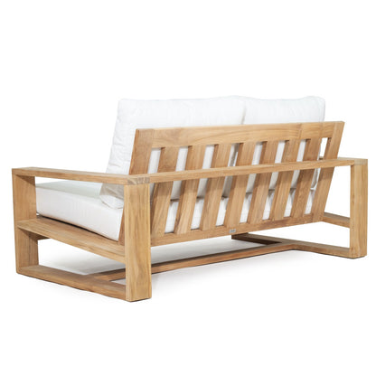Solid Teak Outddoor sofa with white Sunbrella weather proof cushions on a white background
