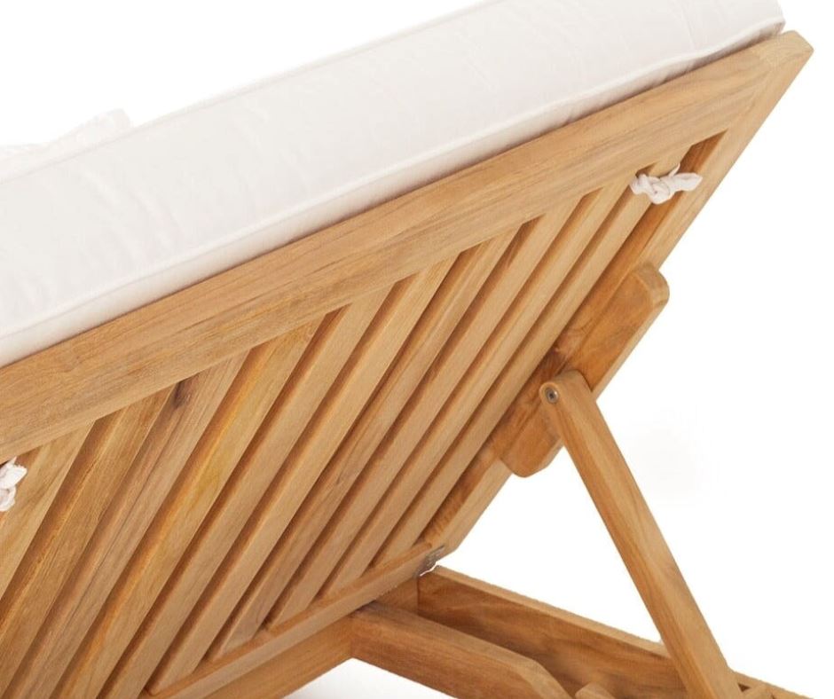 Teak outdoor sunlounge with white cushions on a white background 