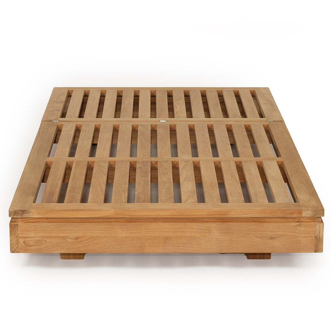 Teak outdoor sunlounge with white cushions on a white background 