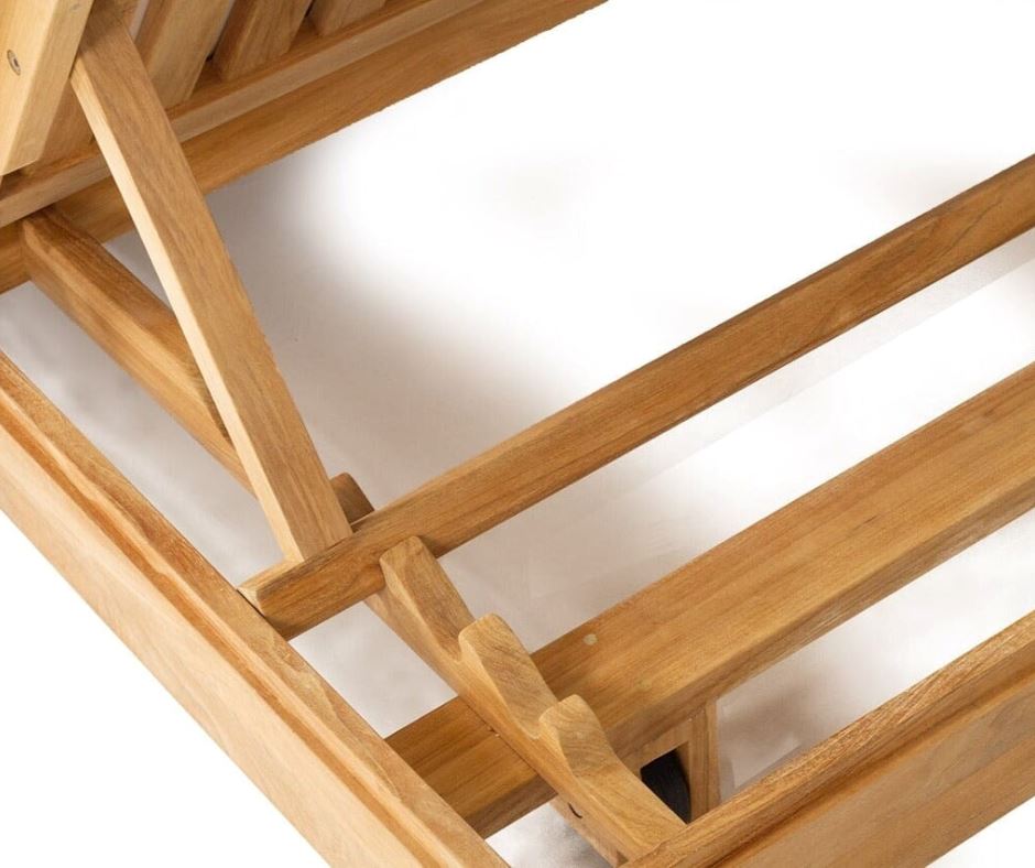 Close-up of a teak sunlounge structure on a white background