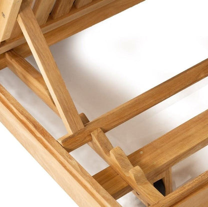 Close-up of a teak sunlounge structure on a white background