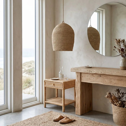 Nordic interior design with wooden furniture, pendant lamp, and large mirror.